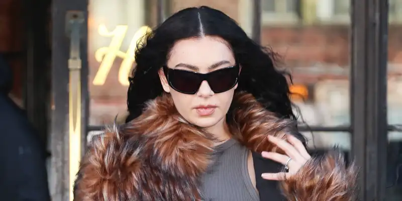 Charli XCX Styles Taylor Swift's favoriteバ420 bag, Fur Coat and Jort