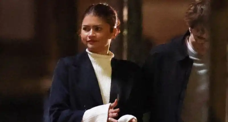 Zendaya and Robert Pattinson coordinate a cozy sweater on the set of a new movie