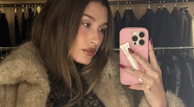 Hailey Bieber's postpartum style now includes lace tops, visible bras and fur coats