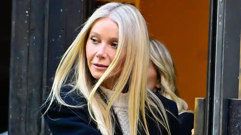 Gwyneth Paltrow looks like a quiet luxury royal in a cable knit sweater and structured black overcoat