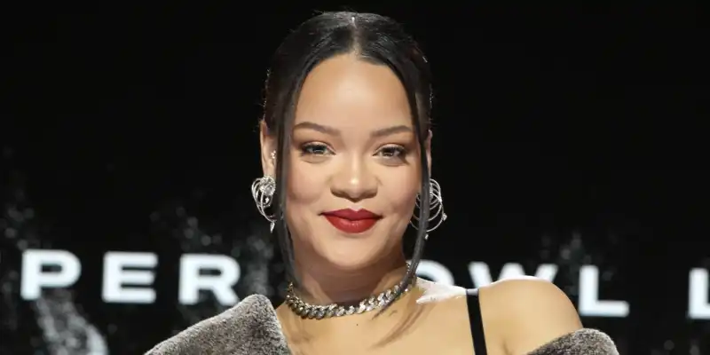 Rihanna is Richest Girl at Holiday Party in $2,184 Fur Dress and Alaia Bag